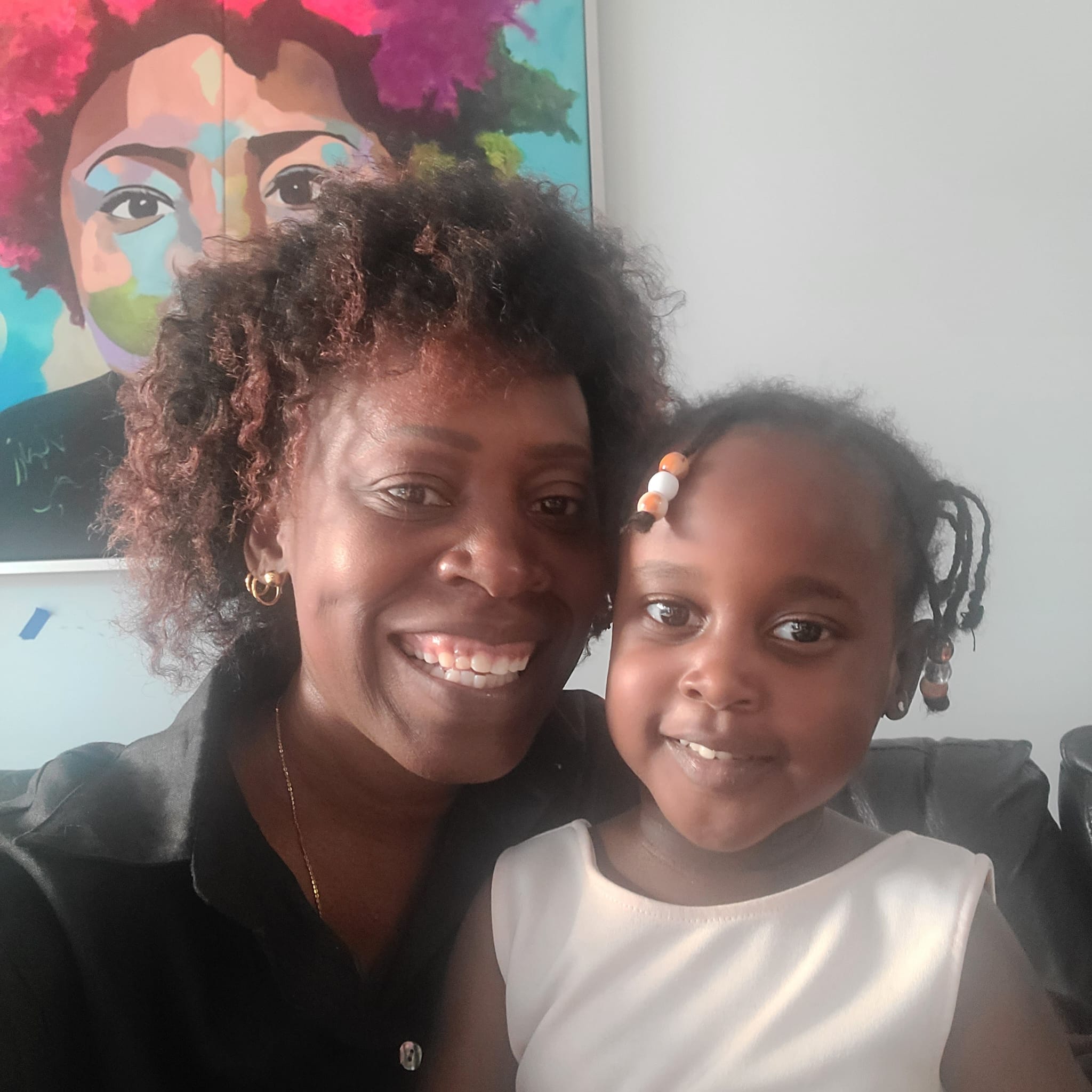 Michelle Mbeo and her Niece authors of We're all Children of the world book